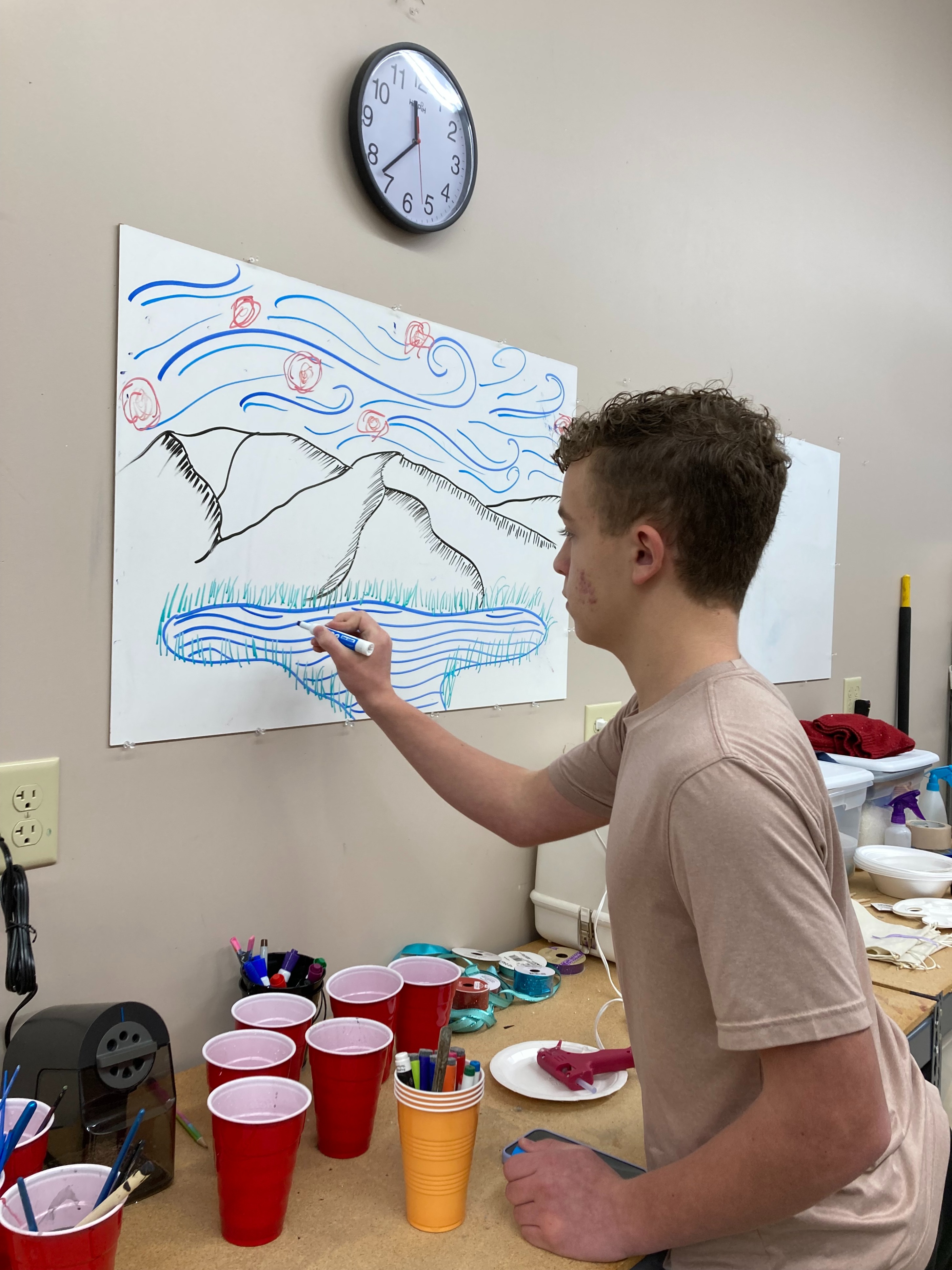 Boy painting wall